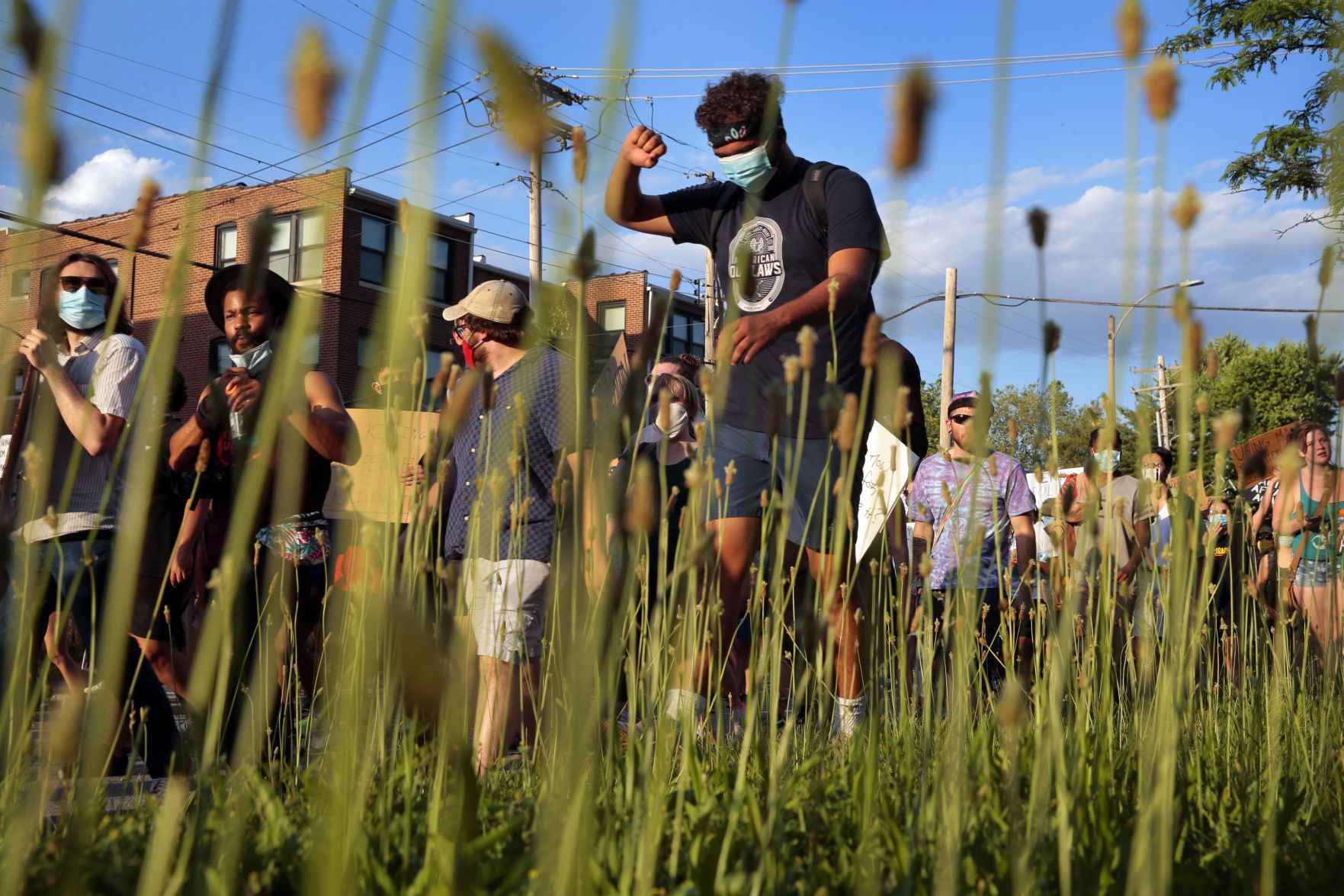 Protesters march through the Delmar Loop
